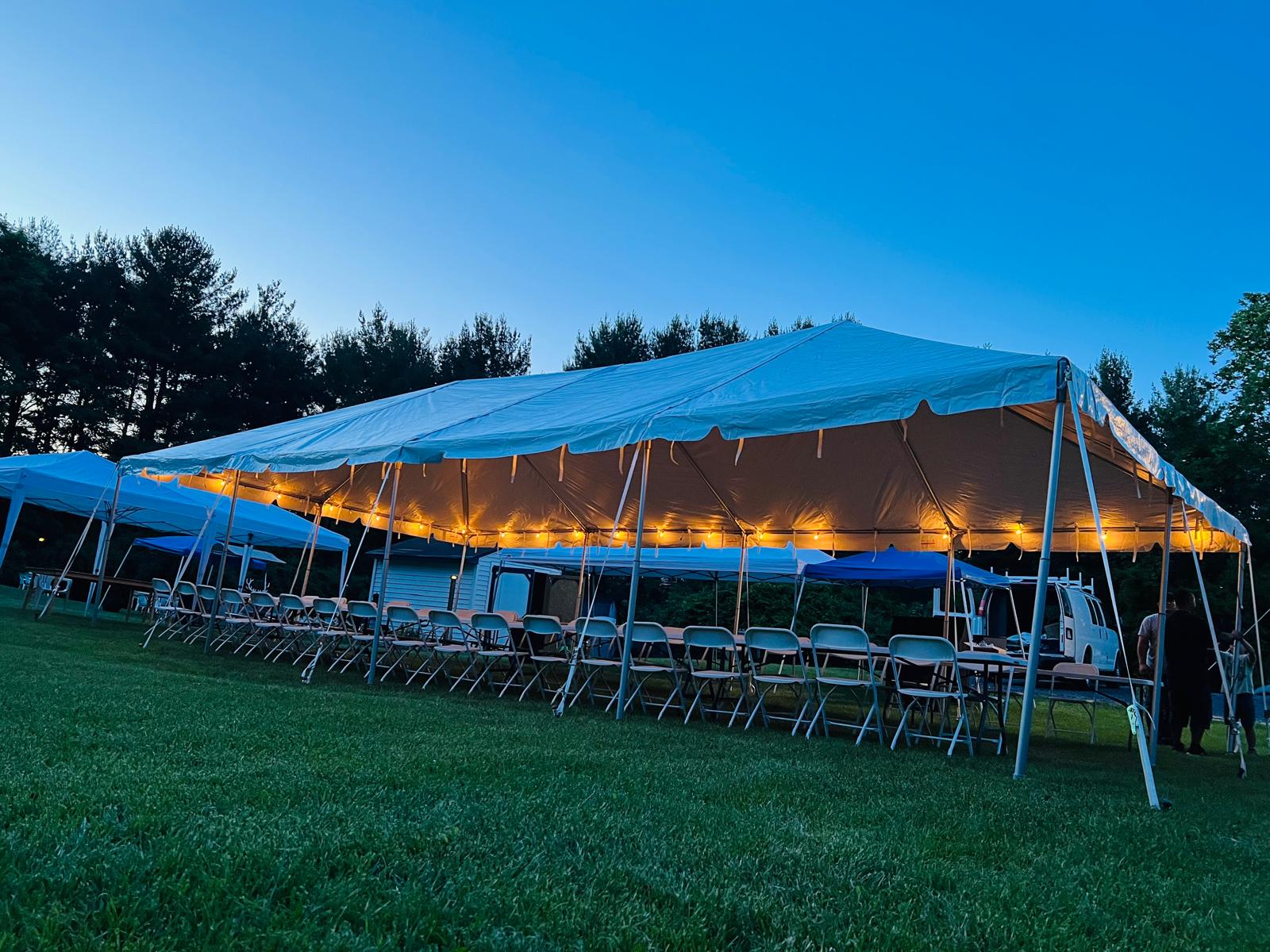 MCS Events tent, table, chairs, and lighting rentals being used for event in DMV area